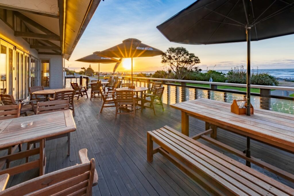 A sunset view from the deck at Beachfront Hotel - Best South Island Hotels - Silver Fern Holidays